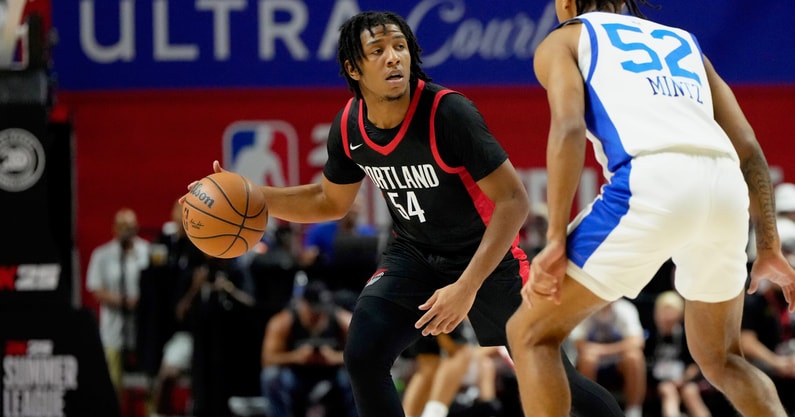 Jul 15, 2024; Las Vegas, NV, USA; Portland Trail Blazers guard Kennedy Chandler (54) controls the ball against Philadelphia 76ers guard Judah Mintz (52) during the first half at Thomas &amp; Mack Center. Mandatory Credit: Lucas Peltier-USA TODAY Sports
