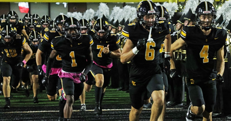 The Southeast Polk Rams take the field before an Iowa high school football game against the Waukee Warriors.
