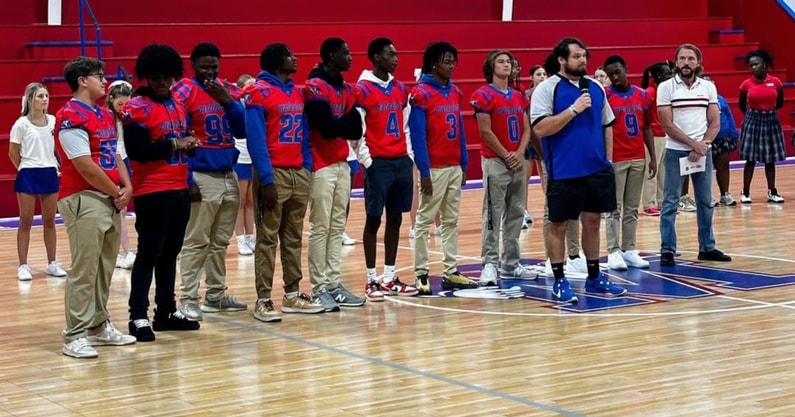 Memorial Day football team introduced at a pep rally.