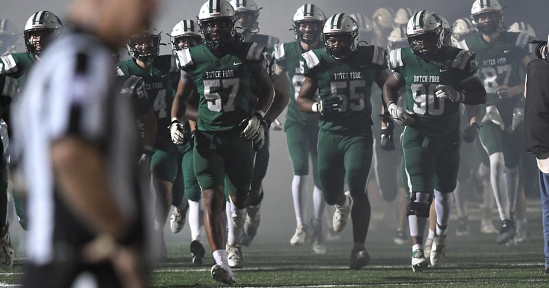 Dutch Fork players enter the field before a South Carolina high school football game.