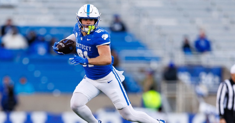 Nov 16, 2024; Lexington, Kentucky, USA; Kentucky Wildcats tight end Willie Rodriguez (81) leaps over a Murray State Racers defender during the fourth quarter at Kroger Field. Mandatory Credit: Jordan Prather-Imagn Images