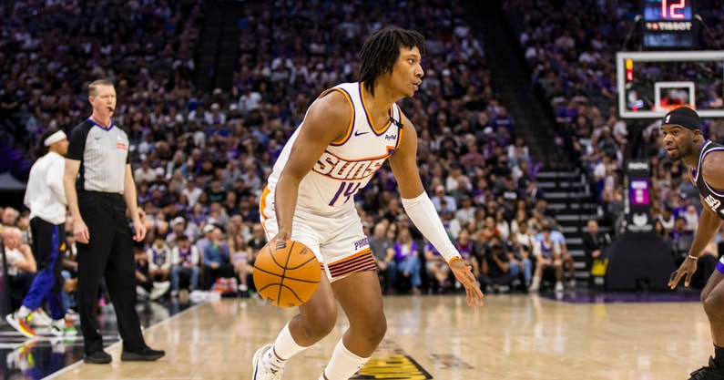 Apr 13, 2025; Sacramento, California, USA; Phoenix Suns guard TyTy Washington Jr. (14) dribbles against the Sacramento Kings during the fourth quarter at Golden 1 Center. Mandatory Credit: John Hefti-Imagn Images