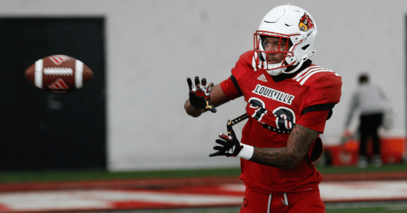 Louisville’s Tayon Holloway (20) catches the ball during Spring Practice on Thursday. April 4, 2024