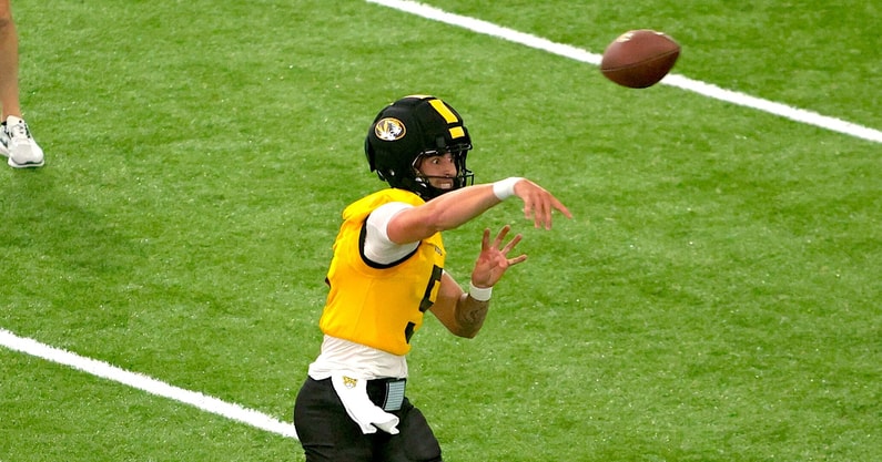 Matt Zollers throws a pass
