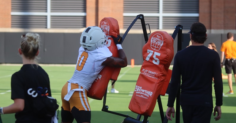 TE Ethan Davis gets in work in a sled drill
