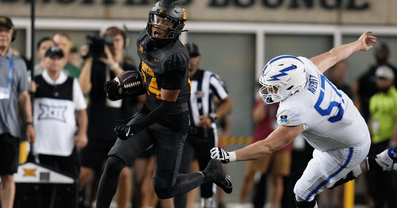 Sep 14, 2024; Waco, Texas, USA; Baylor Bears safety Corey Gordon Jr. (24) evades Air Force Falcons offensive lineman Gabriel Averitt (57) after making an interception against Air Force Falcons quarterback Josh Johnson (11) during the second half at McLane Stadium. Mandatory Credit: Chris Jones-Imagn Images