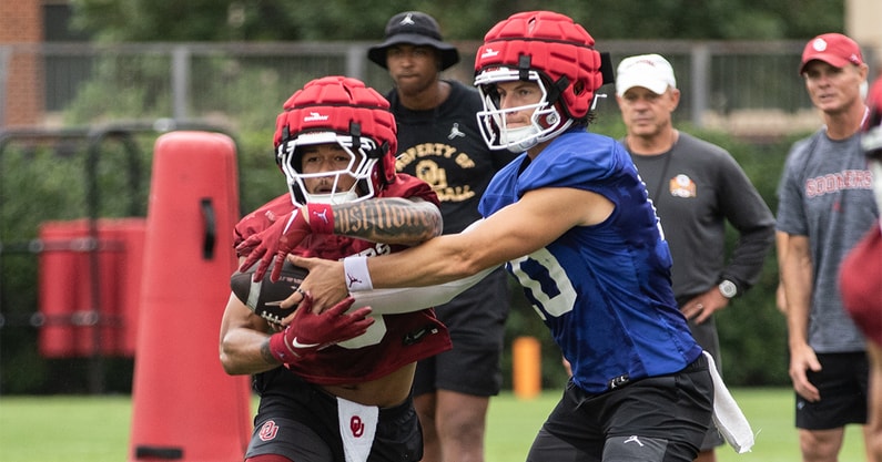 John Mateer hands off to Jaydn Ott