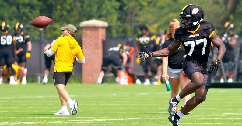Marquise Davis reaches back for a pass