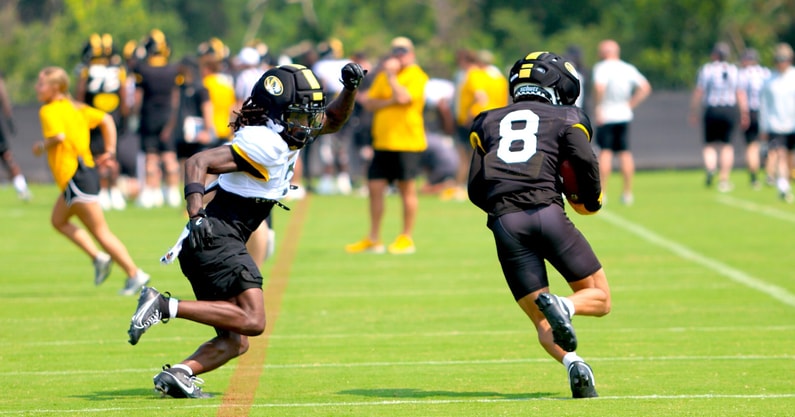 Shaun Terry (8) jukes around Toriano Pride (2)