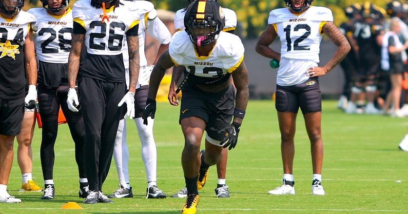 Daylan Carnell (13) charges into a drill