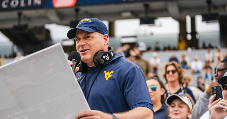 West Virginia head coach Rich Rodriguez calling plays during practice