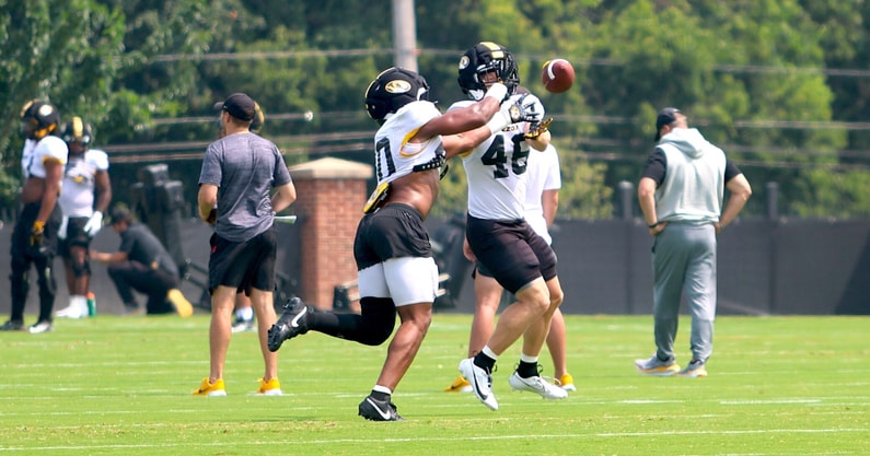 Josiah Trotter (left) jumps a pass to Jackson Daily (46) in practice