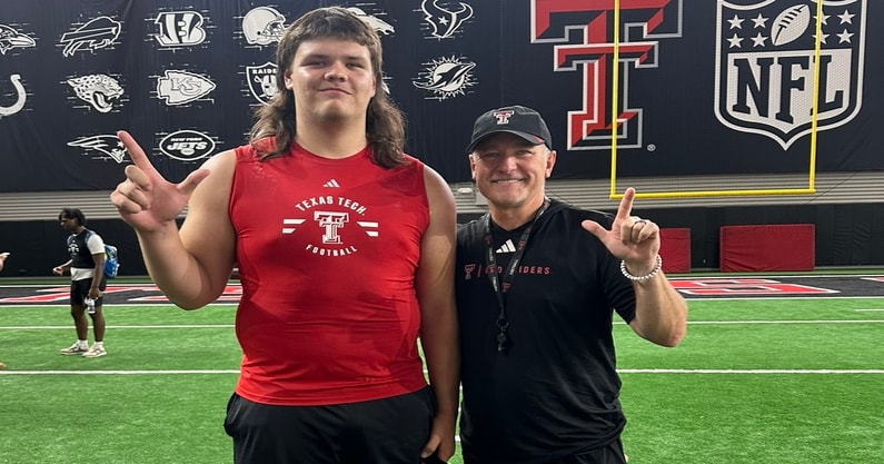 Alexander Herrera with Texas Tech head coach Joey McGuire