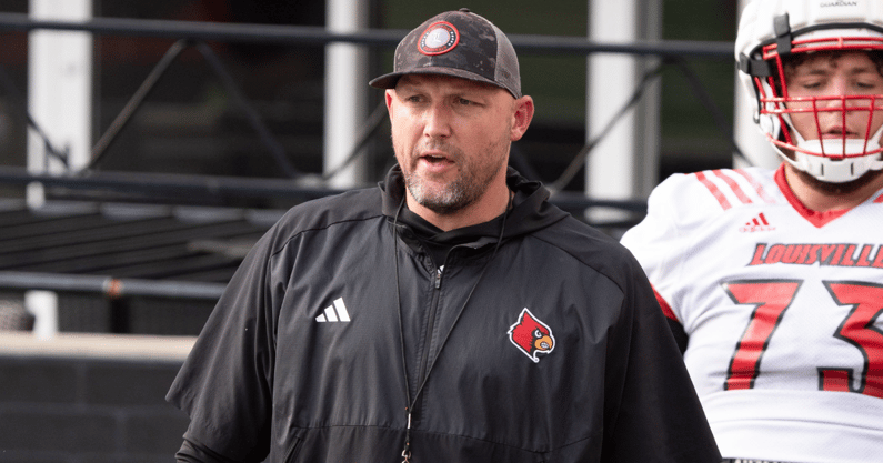 University of Louisville offensive line coach Richard Owens runs a drill during their second practice on Friday, Aug. 2, 2024 at L&N Federal Credit Union Stadium.