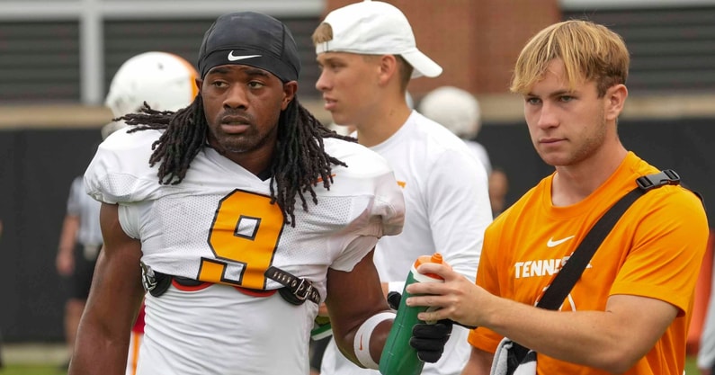 Angelina Alcantar/News Sentinel / USA TODAY NETWORK via Imagn Images | Tennessee running back Star Thomas (9) takes a water bottle from a trainer during Tennessee football preseason practice, in Knoxville, Tennessee, Aug. 6, 2025.