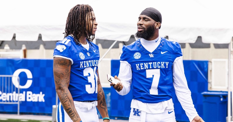 Kentucky LBs Quintavion Norman (left) and Daveren Rayner chat at UK Football Media Day, via Aaron Perkins, KSR