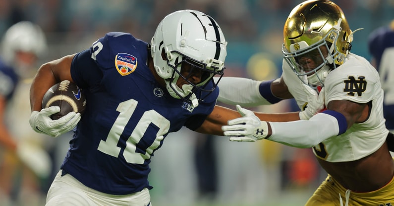 Penn State Nittany Lions running back Nicholas Singleton (10) moves the ball defended by Notre Dame Fighting Irish safety Adon Shuler (8) in the first half in the Orange Bowl at Hard Rock Stadium. (Photo by Sam Navarro-Imagn Images)