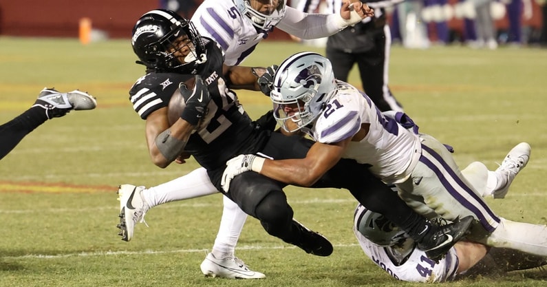 Kansas State Wildcats safety Marques Sigle (21)tackles Iowa State Cyclones running back Abu Sama III (24). (Photo by Reese Strickland-Imagn Images)