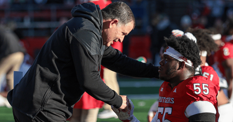 Rutgers HC Greg Schiano talks with defensive lineman Zaire Angoy