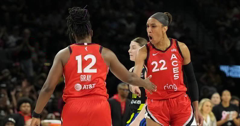 Las Vegas Aces center A'ja Wilson (22) celebrates with guard Chelsea Gray (12) against the Dallas Wings in the second quarter at Michelob Ultra Arena. Mandatory Credit: Candice Ward-Imagn Images