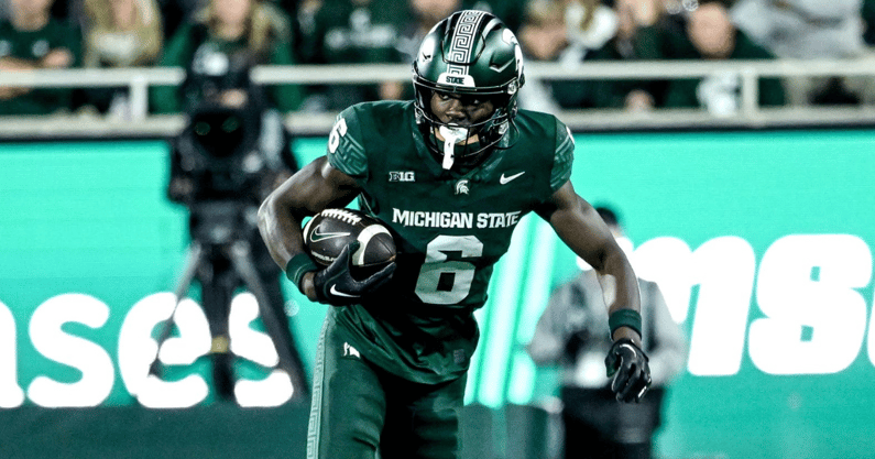 Michigan State's Nick Marsh, right, breaks a tackle attempt by Iowa's John Nestor during the third quarter on Saturday, Oct. 19, 2024, at Spartan Stadium in East Lansing. - Nick King, USA TODAY Sports