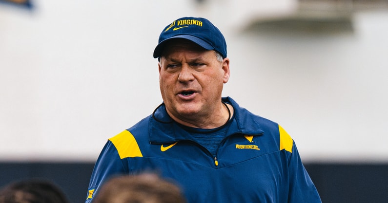 West Virginia head coach Rich Rodriguez addresses his team
