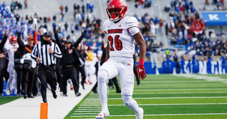 Nov 30, 2024; Lexington, Kentucky, USA; Louisville Cardinals running back Duke Watson (26) carries the ball into the end zone for a touchdown during the third quarter against the Kentucky Wildcats at Kroger Field. Mandatory Credit: Jordan Prather-Imagn Images