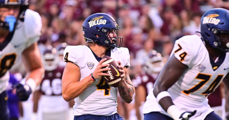 Sep 14, 2024; Starkville, Mississippi, USA; Toledo Rockets quarterback Tucker Gleason (4) looks to pass against the Mississippi State Bulldogs during the first quarter at Davis Wade Stadium at Scott Field. Mandatory Credit: Matt Bush-Imagn Images