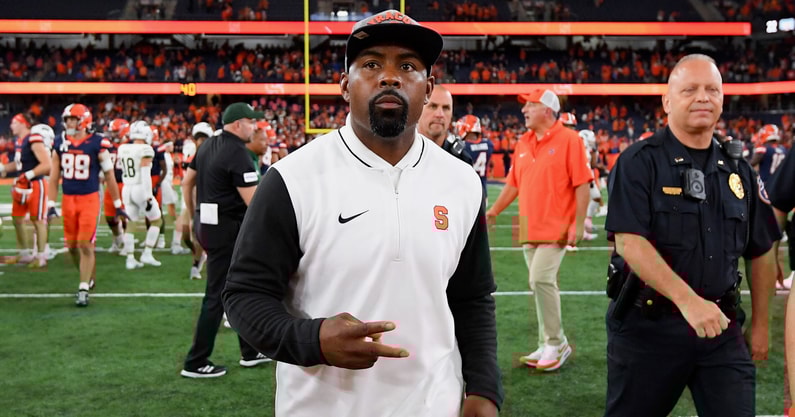 Rich Barnes-USA TODAY Sports | Aug 31, 2024; Syracuse, New York, USA; Syracuse Orange head coach Fran Brown walks on the field after a game against the Ohio Bobcats at the JMA Wireless Dome.
