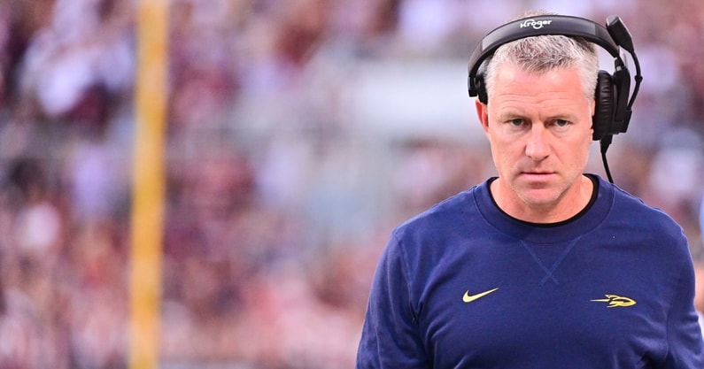 Sep 14, 2024; Starkville, Mississippi, USA; Toledo Rockets head coach Jason Candle walks down the field during the first quarter of the game against the Mississippi State Bulldogs at Davis Wade Stadium at Scott Field. Mandatory Credit: Matt Bush-Imagn Images