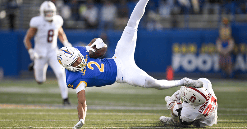 Nov 29, 2024; San Jose, California, USA; San Jose State Spartans wide receiver TreyShun Hurry (2) gets tripped up by Stanford Cardinal safety Scotty Edwards (21) in the second quarter at CEFCU Stadium. Mandatory Credit: Eakin Howard-Imagn Images