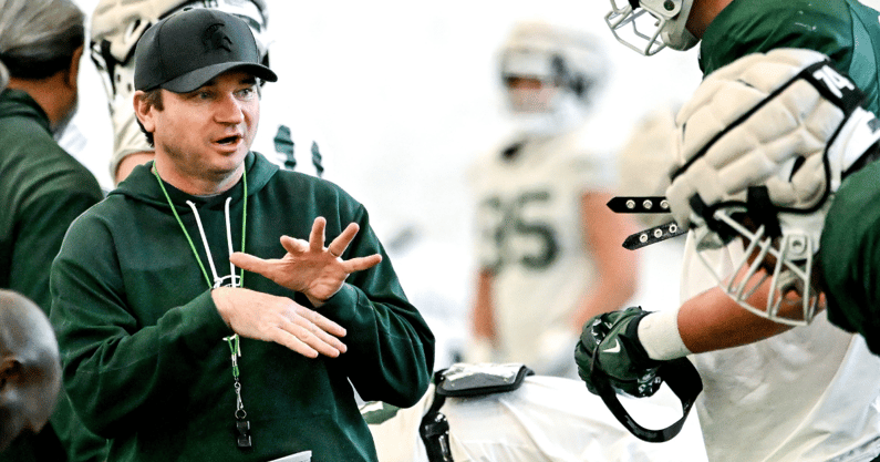 Michigan State's head coach Jonathan Smith, left, talks with Justin Bell during football practice on Tuesday, April 8, 2025, in East Lansing. - Nick King, USA TODAY Sports