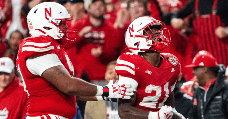Nebraska football RB Emmett Johnson (right) and OL Justin Evans during the 2024 season