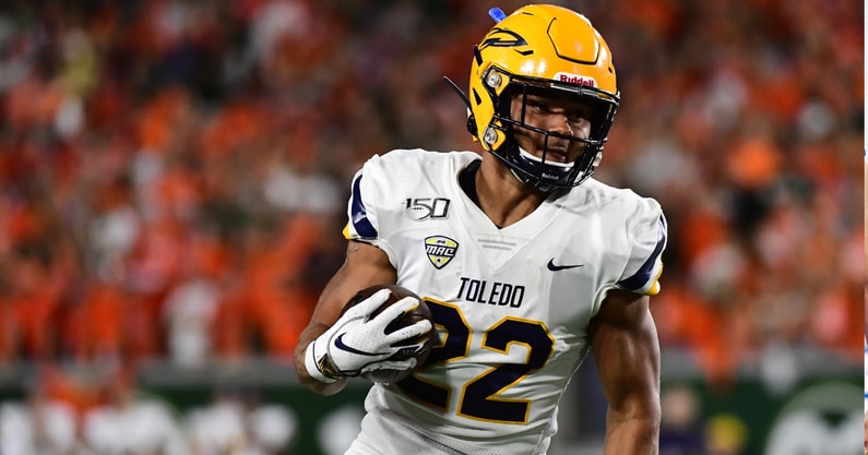 Sep 21, 2019; Fort Collins, CO, USA; Toledo Rockets running back Bryant Koback (22) carries the ball against the Colorado State Rams in the first quarter at Sonny Lubrick Field at Canvas Stadium. Mandatory Credit: Ron Chenoy-Imagn Images