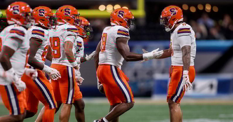 Aug 30, 2025; Atlanta, Georgia, USA; Syracuse Orange defensive lineman David Reese (8) celebrates with defensive lineman Denis Jaquez Jr. (11) after a fumble recovery against the Tennessee Volunteers in the first quarter at Mercedes-Benz Stadium. Mandatory Credit: Brett Davis-Imagn Images