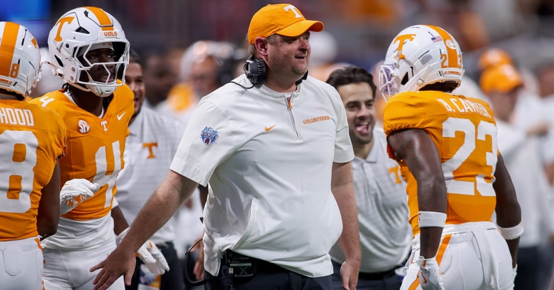 Aug 30, 2025; Atlanta, Georgia, USA; Tennessee Volunteers head coach Josh Heupel talks to Syracuse Orange head coach Fran Brown before a game at Mercedes-Benz Stadium. Mandatory Credit: Brett Davis-Imagn Images