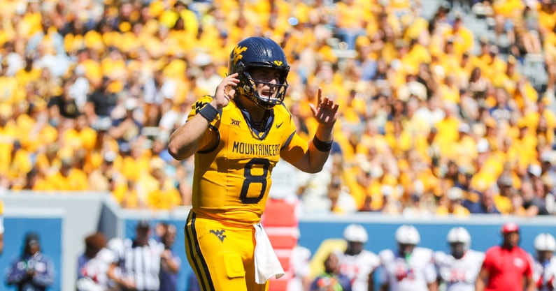 West Virginia quarterback Nicco Marchiol looks for the call from the sideline
