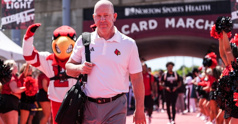 Louisville head football coach Jeff Brohm leads the team on the Card March before the game against EKU at the Cardinals' season opener Saturday, August 30, 2025 at L&N Federal Credit Union Stadium in Louisville, Kentucky.