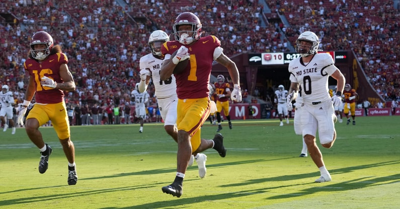 USC Trojans running back Eli Sanders (1) is pursued by Missouri State Bears safety J.J. O'Neal (16) and safety Maguire Neal (0) on a 73-yard touchdown reception in the first half at United Airlines Field at Los Angeles Memorial Coliseum