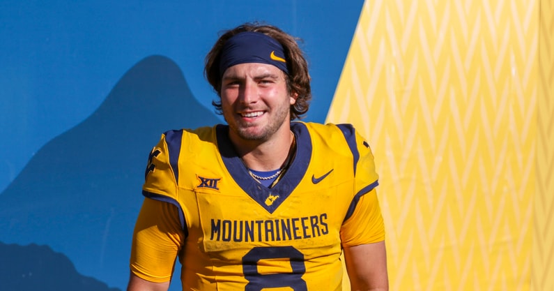 West Virginia quarterback Nicco Marchiol enjoys the with Mountaineer fans