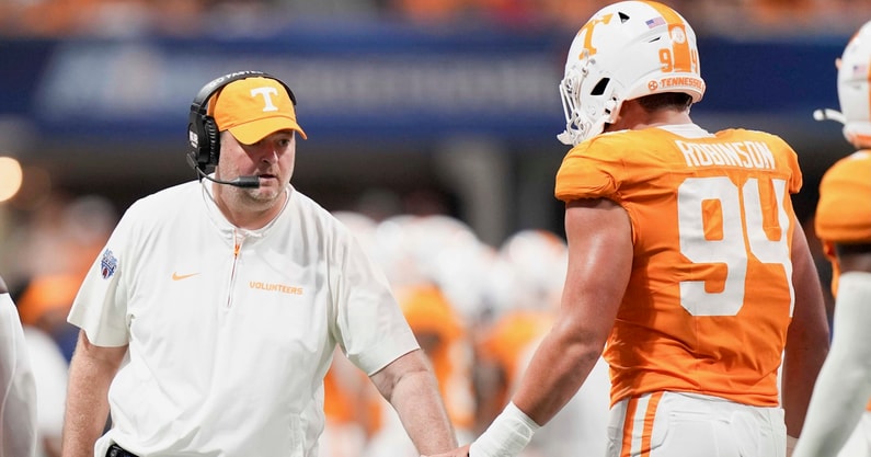 Brianna Paciorka/News Sentinel / USA TODAY NETWORK via Imagn Images | Tennessee head coach Josh Heupel high fives Tennessee defensive lineman Nathan Robinson (94) during the Aflac Kickoff Game between the Volunteers and Syracuse held at Mercedes-Benz Stadium in Atlanta, Ga., on August 30, 2025.