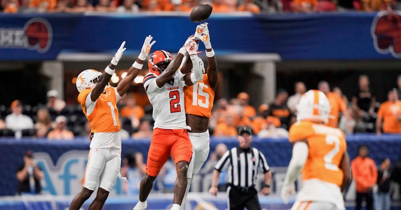 Tennessee defensive back Rickey Gibson III (1) and Tennessee defensive back Edrees Farooq (15) defend Syracuse wide receiver Johntay Cook (2) during the Aflac Kickoff Game between the Volunteers and Syracuse held at Mercedes-Benz Stadium in Atlanta, Ga., on August 30, 2025.