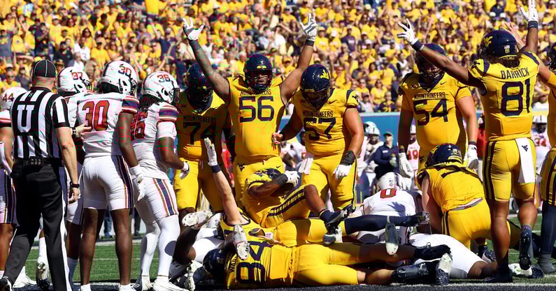 West Virginia lineman Kimo Makane'ole celebrates with his teammates