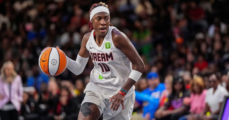 Aug 27, 2025; College Park, Georgia, USA; Atlanta Dream guard Rhyne Howard (10) controls the ball against the Las Vegas Aces during the second half at Gateway Center Arena at College Park. Mandatory Credit: Dale Zanine-Imagn Images