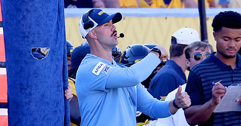 West Virginia defensive coordinator Zac Alley calls the play