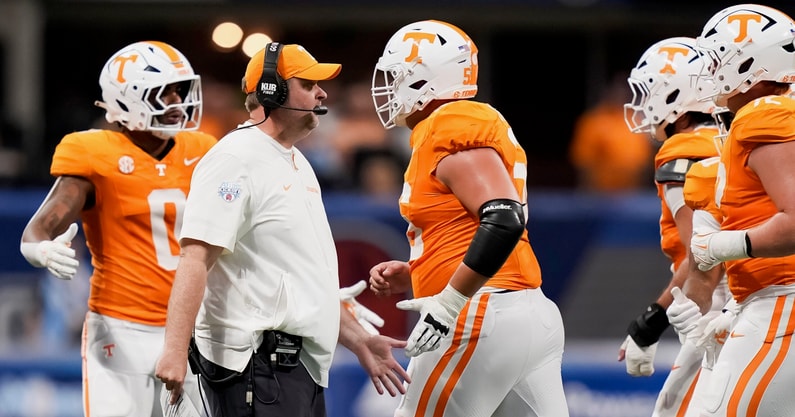 Brianna Paciorka/News Sentinel / USA TODAY NETWORK via Imagn Images | Tennessee head coach Josh Heupel high fives players running off the field during the Aflac Kickoff Game between the Volunteers and Syracuse held at Mercedes-Benz Stadium in Atlanta, Ga., on August 30, 2025.