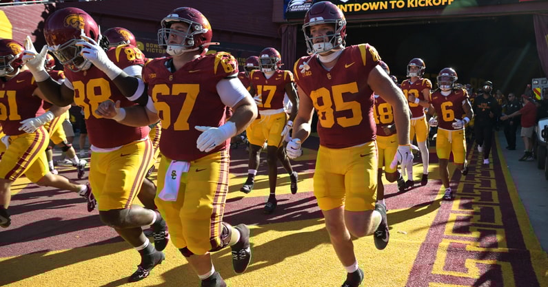 USC Trojans players run on to the field for the game against the Georgia Southern Eagles at United Airlines Field at the Los Angeles Memorial Coliseum