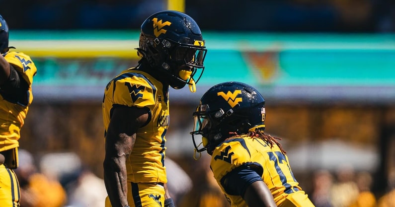 West Virginia defensive back Jordan Scruggs celebrates the pass breakup