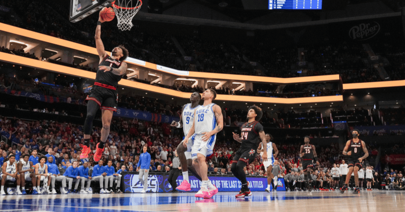 Mar 15, 2025; Charlotte, NC, USA; Louisville Cardinals guard J'Vonne Hadley (1) goes to the basket against Duke Blue Devils during the 2025 ACC Conference Championship game at Spectrum Center. Mandatory Credit: Jim Dedmon-Imagn Images
