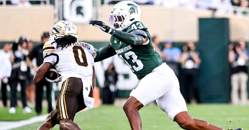 Michigan State's Malik Spencer, right, tackles Western Michigan's Tailique Williams during the first quarter on Friday, Aug. 29, 2025, in East Lansing. (© Nick King/Lansing State Journal / USA TODAY NETWORK via Imagn